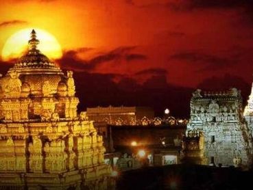 Sunset behind a beautifully lit ancient temple complex.
