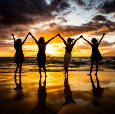 family of 4 holding hands