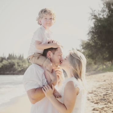 family of 3 on the beach