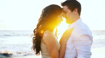 Maui couple touching foreheads during sunset