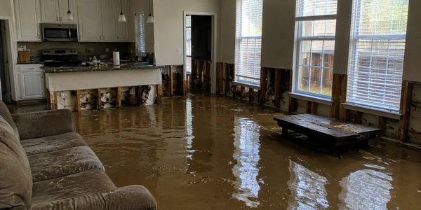Living room flooded with water after severe damage.