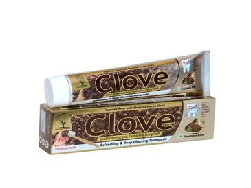Clove toothpaste tube and box highlighting natural herbs and deep cleaning benefits.
