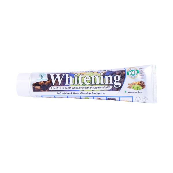 Tube of whitening toothpaste with natural herbs and nHA for effective tooth whitening.