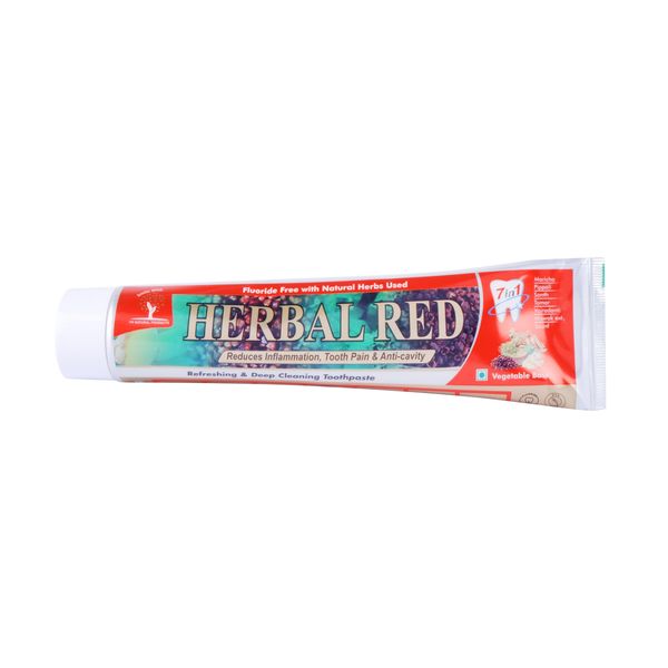 Tube of Herbal Red toothpaste with natural herbs for oral care.