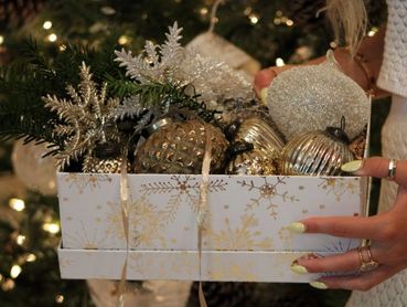 Gift Box of Gold and White glass Christmas Ornaments with Snowflake accents.