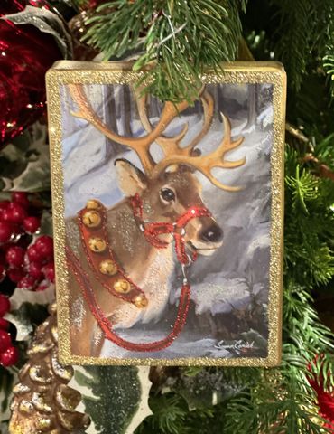 Melrose gold glittered framed reindeer glass ornament with sleigh bells around his neck.