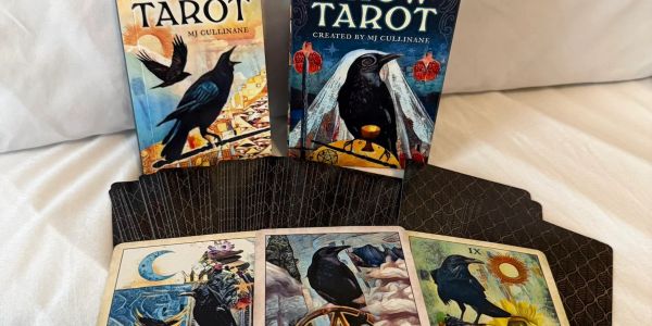 Tarot cards featuring ravens and mystical imagery by MJ Cullinane.