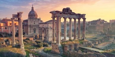 Ancient Roman ruins at sunset.