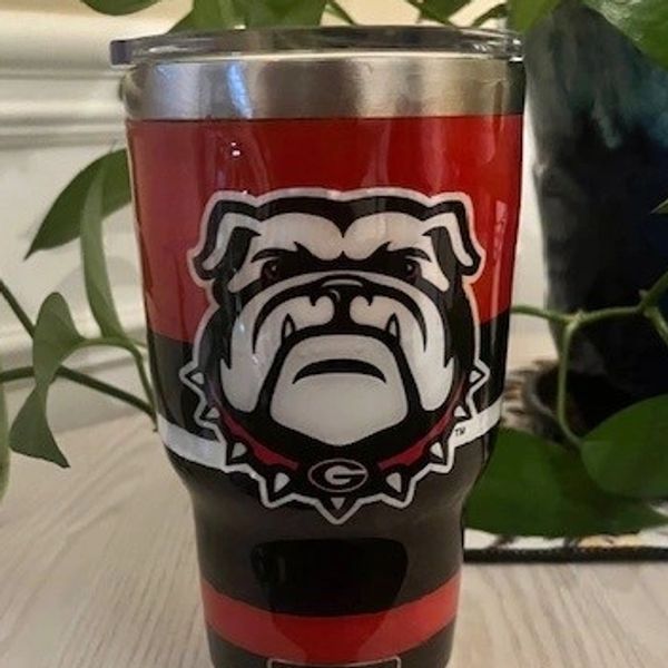 Acrylic painted tumbler featuring your favorite team! Covered in epoxy for a smooth finish!