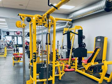 Bright yellow gym equipment arranged neatly.