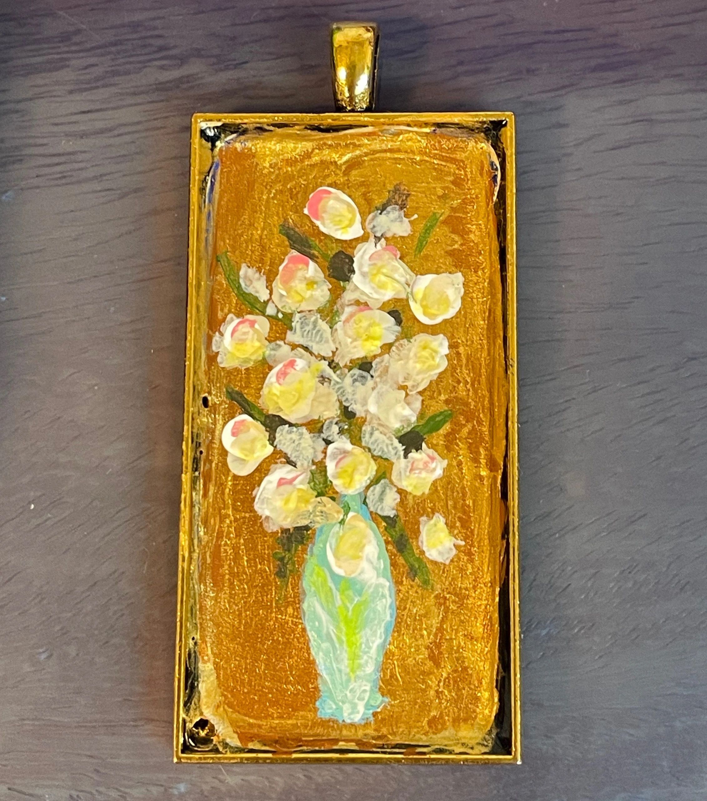 Brass frame with Gold background. Blue vase of white roses. Hand painted.