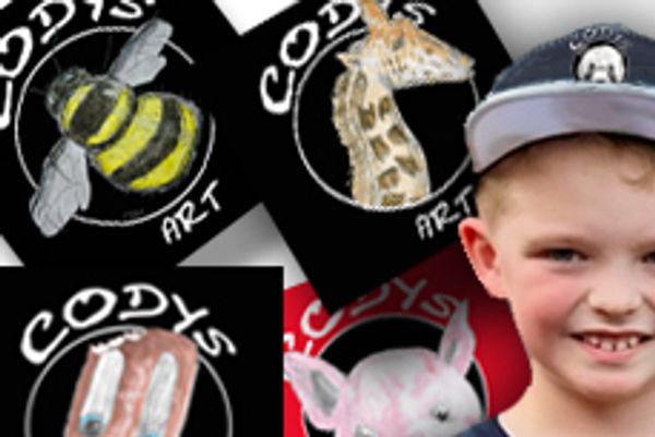 A smiling young boy standing in front of a background featuring circular animal illustrations 