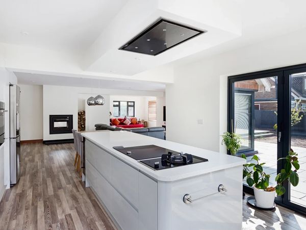 Modern kitchen with a large island kitchen top in the center of it