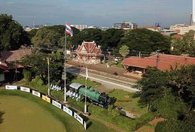 Putting green Royal Hua Hin golf course with Railway Station behind. Golf Sea City Guest house