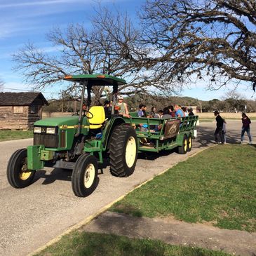 Tractor and hayride ready to depart the visitor center.