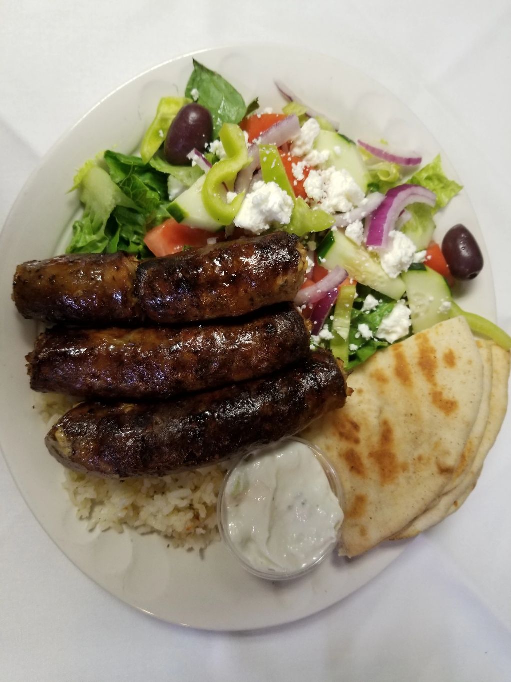 Loukaniko Platter with Greek Salad Rice and Tzatiki