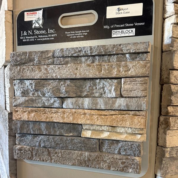 Sample board of precast stone veneer by J.&amp;N. Stone, Inc. with various stone textures and colors.