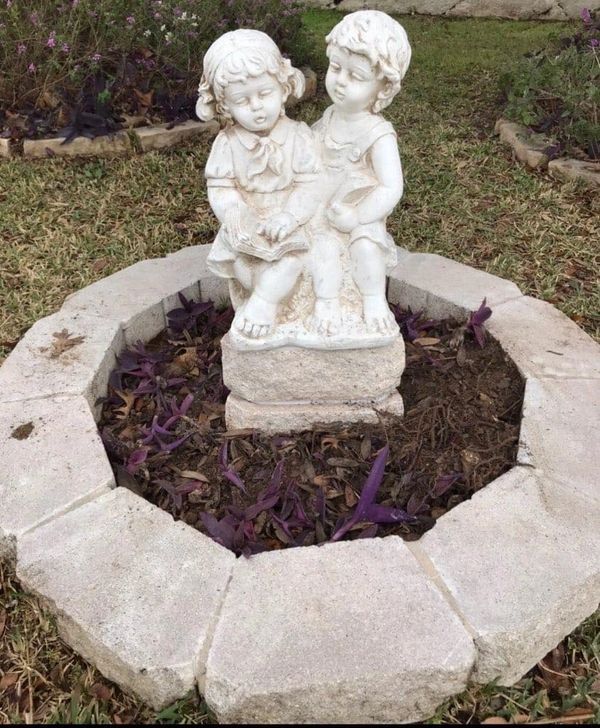 Plaster statues of boy and girl 