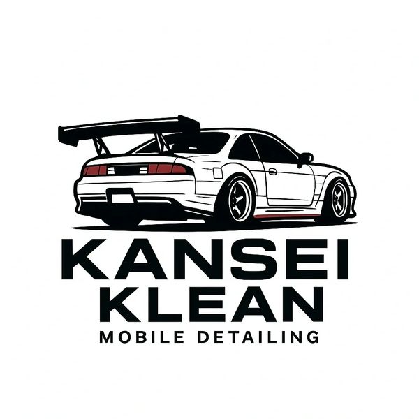 Sleek car with large spoiler above bold Kansei Klean mobile detailing text.