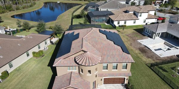 Custom solar panel installation on a large Florida home built for efficiency and storm reliability.