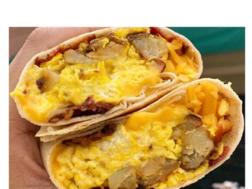 Overstuffed breakfast wrap filled with egg, cheese, potato, bacon, or sausage. 