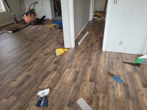 We finished laying new laminate vinyl plank flooring throughout the home. 