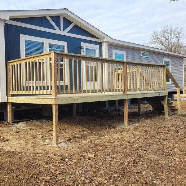 New custom patio installation on a blue manufactured home. 