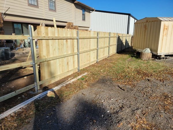 New wooden privacy fence construction. 
