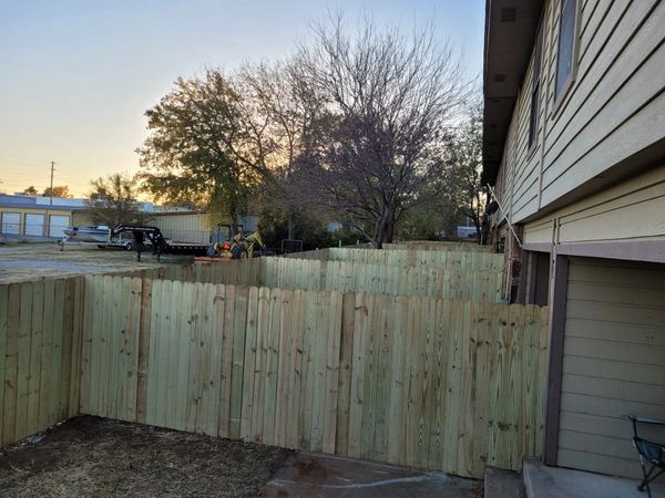 300+ feet of privacy fence for 7-unit townhouses. Each unit with its own yardspace. 