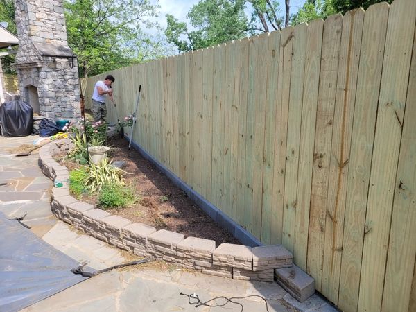 New privacy fence installation in backyard. 