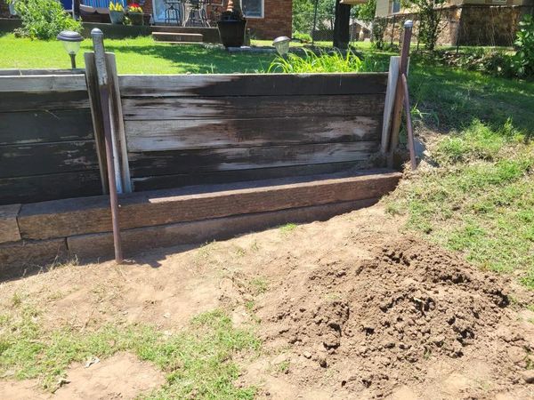 Black retaining wall repair. 