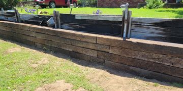 Railroad tie retaining wall repair. 