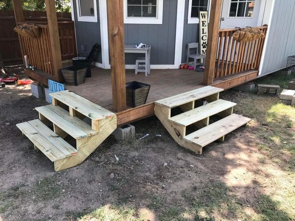 Two sets of newly built porch stairs. 