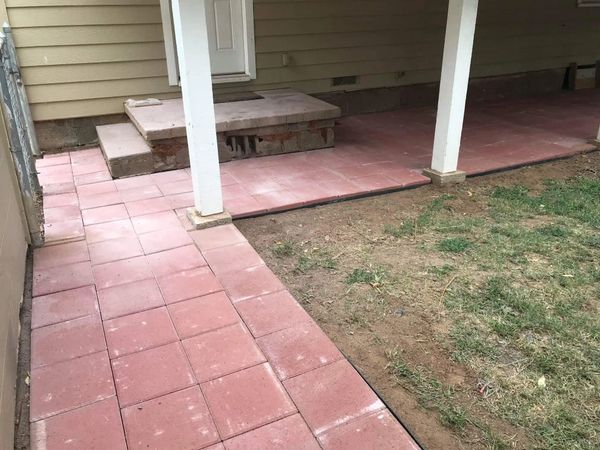 Red paving stones in back patio area. 