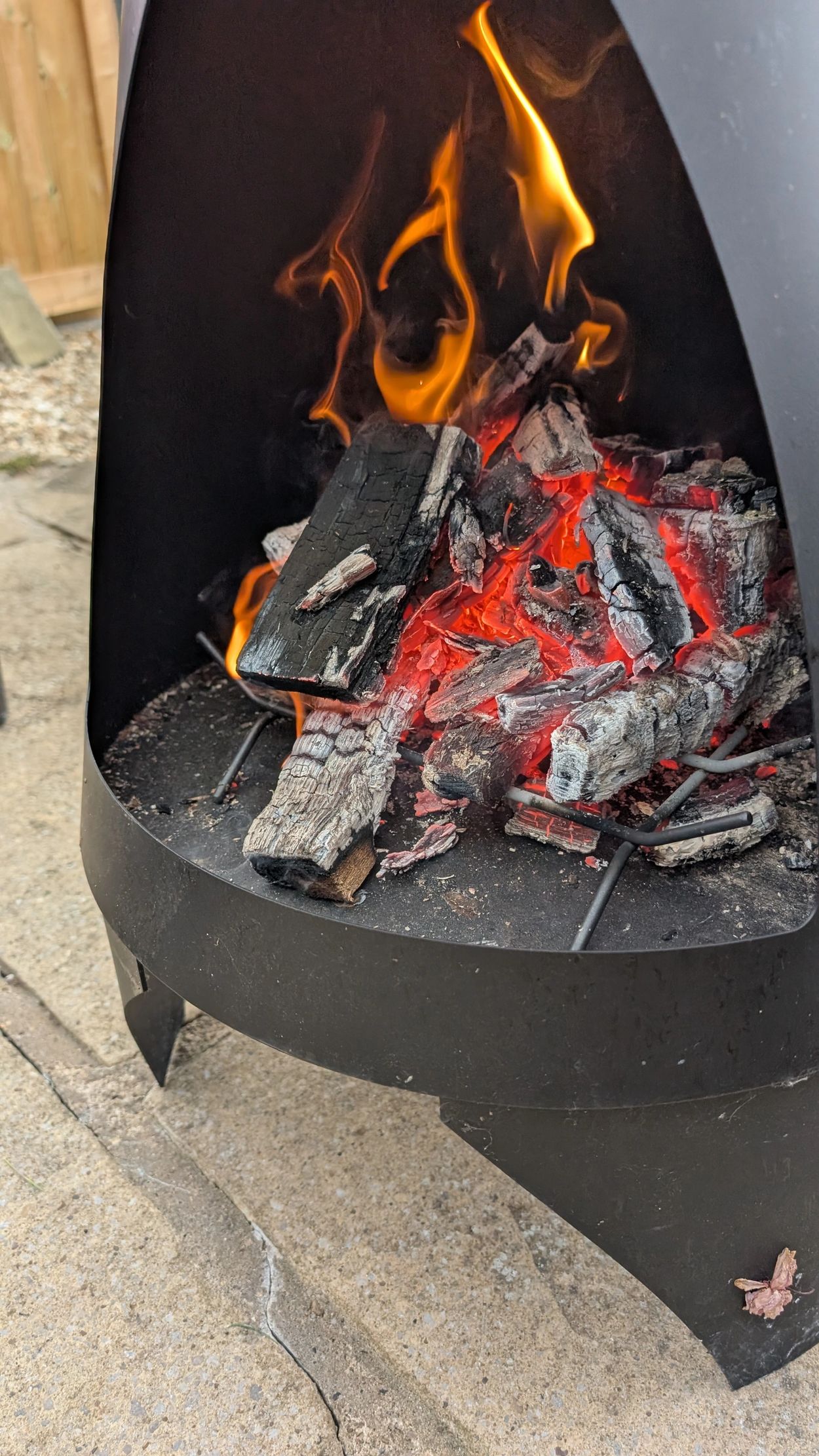 A Fire pit burning our wood
