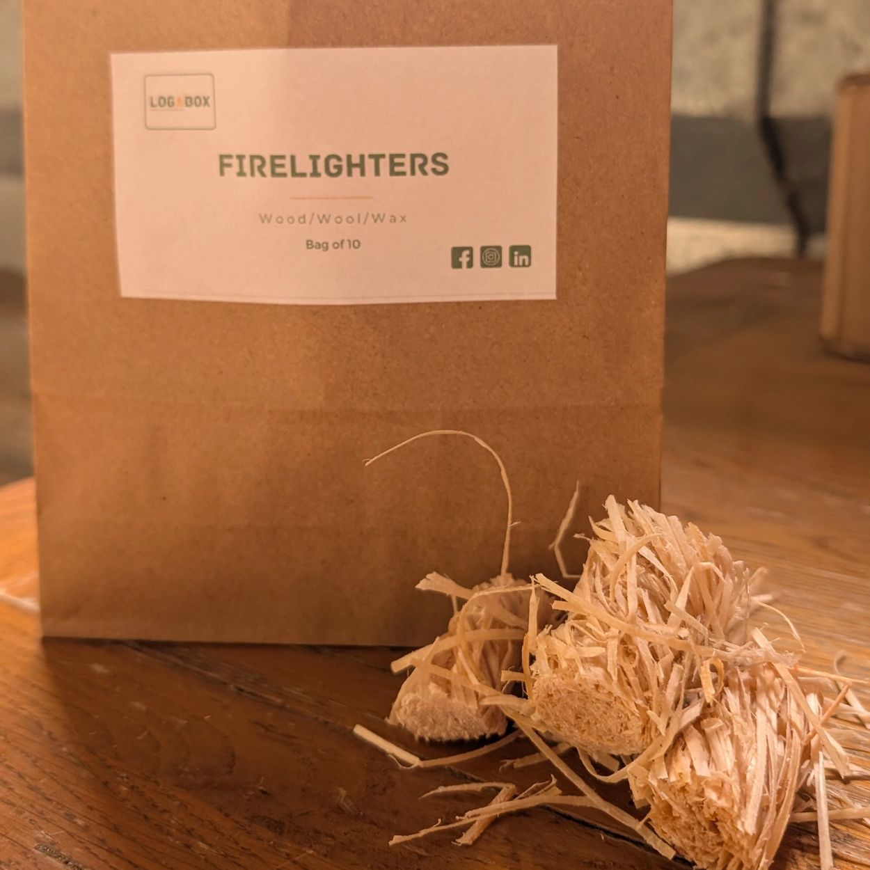 Our Firelighter-bag with options of 10,25 and boxes of 50 wood wool and bee wax natural lighters.