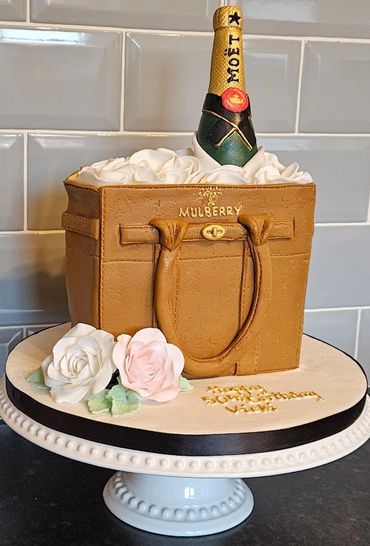 Mulberry handbag cake with champagne bottle and handmade roses