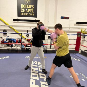 Two people boxing at Holmes Chapel Boxing Club.