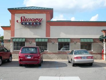 The Outside Of A Building WIth Parking