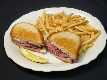 Sandwitch With Fries On A WHite Plate