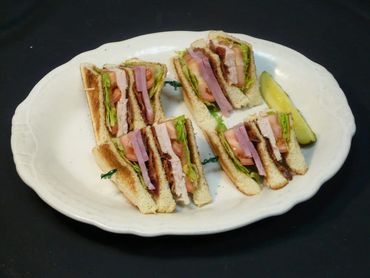 A Sandwitch Placed On A White Plate