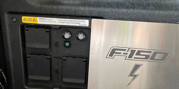Ford accessory stainless steel cover that protects your outlet box on the bed of your F-150.
