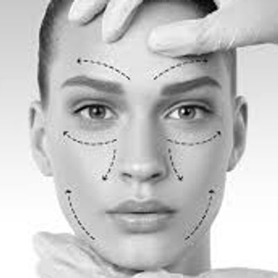 Woman's face with cosmetic surgery markings and gloved hands framing it.