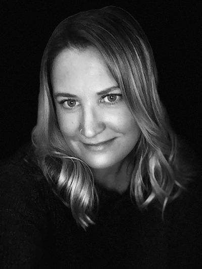 Black and white portrait of a woman with shoulder length hair