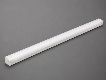 White LED tube light on a gray surface.