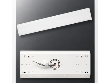 Disassembled LED light fixture with wires.