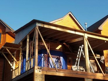 Custom hand framed roof over existing deck. 