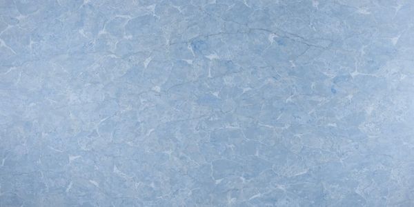 Blue textured surface with abstract patterns.