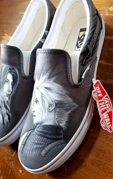 Vans slip-on shoes with detailed anime character artwork in grayscale.