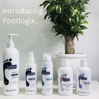 Image shows 5 of the footlogix products standing on a white surface in front of a pot plant in a whi